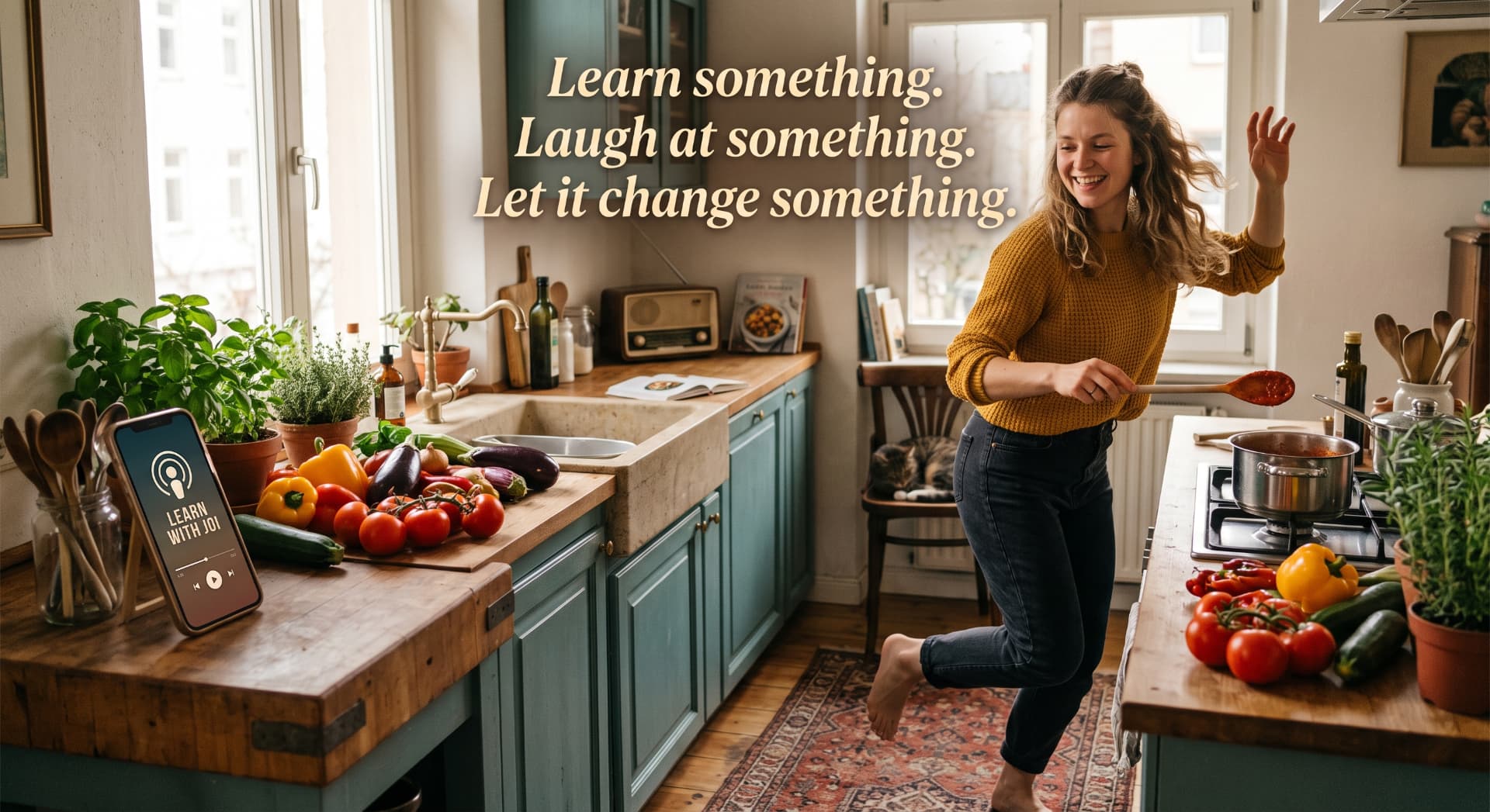 A woman dancing with a wooden spoon in a sunlit kitchen while a phone plays the Learn With Joi podcast, with the words, Learn something. Laugh at something. Let it change something.