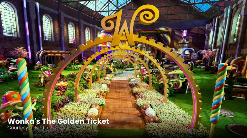 The golden W arches of the chocolate factory in Wonka's The Golden Ticket, courtesy of Netflix