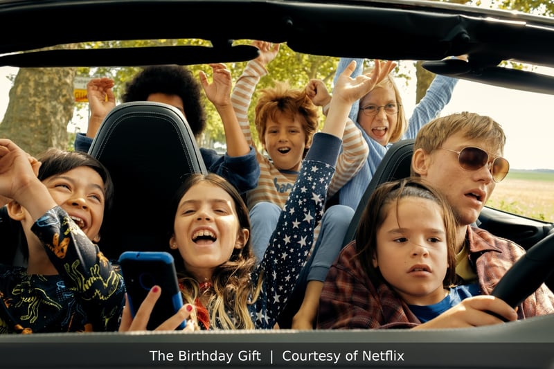 Children cheer in a convertible in The Birthday Gift, courtesy of Netflix